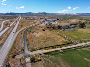 View of property location with a mountain backdrop and rural landscape