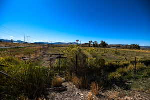 View of mountain background featuring rural landscape