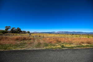 View of mountain backdrop with rural landscape