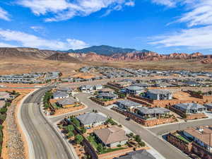 Aerial view of residential area featuring mountains