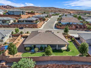 Aerial view of residential area featuring a mountain backdrop