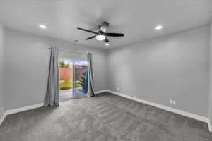 Spare room with carpet, recessed lighting, and a ceiling fan