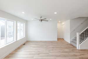 Unfurnished living room with recessed lighting, light wood-style floors, and ceiling fan
