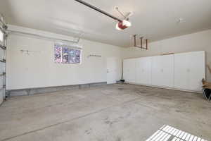 Garage featuring a garage door opener