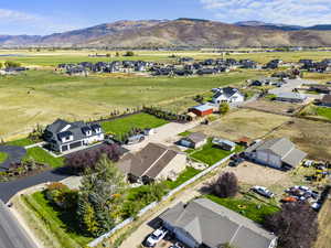 Aerial perspective of suburban area with a mountainous background