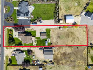 Aerial perspective of suburban area featuring property parcel outlined