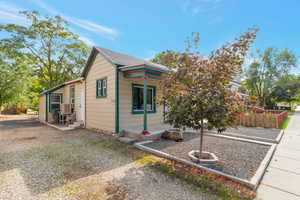 View of front of house featuring cooling unit