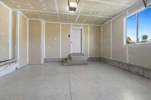 Garage featuring a garage door opener