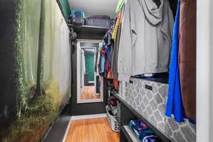 Walk in closet featuring light wood finished floors