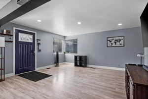 Foyer entrance featuring recessed lighting and light wood finished floors