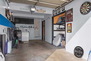 Garage featuring a garage door opener