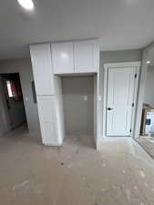 Kitchen with refrigerator insert and pantry
