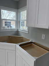 Kitchen with white cabinets and a sink