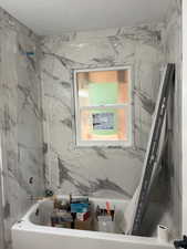 Bathroom with a textured ceiling