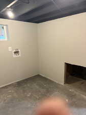 Below grade area featuring baseboards