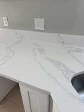 Kitchen view of light stone countertops