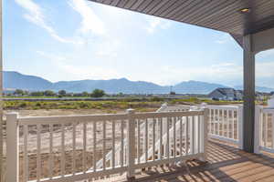 Wooden terrace featuring a mountain view
