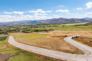 View of mountain background featuring rural landscape