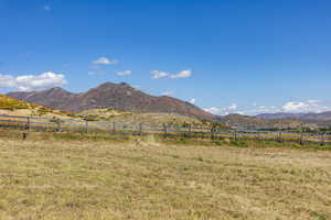 View of mountain backdrop featuring rural landscape