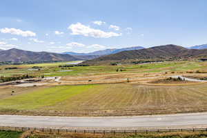 View of mountain backdrop featuring rural landscape