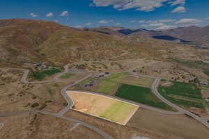 Aerial view of property's location with a mountain backdrop
