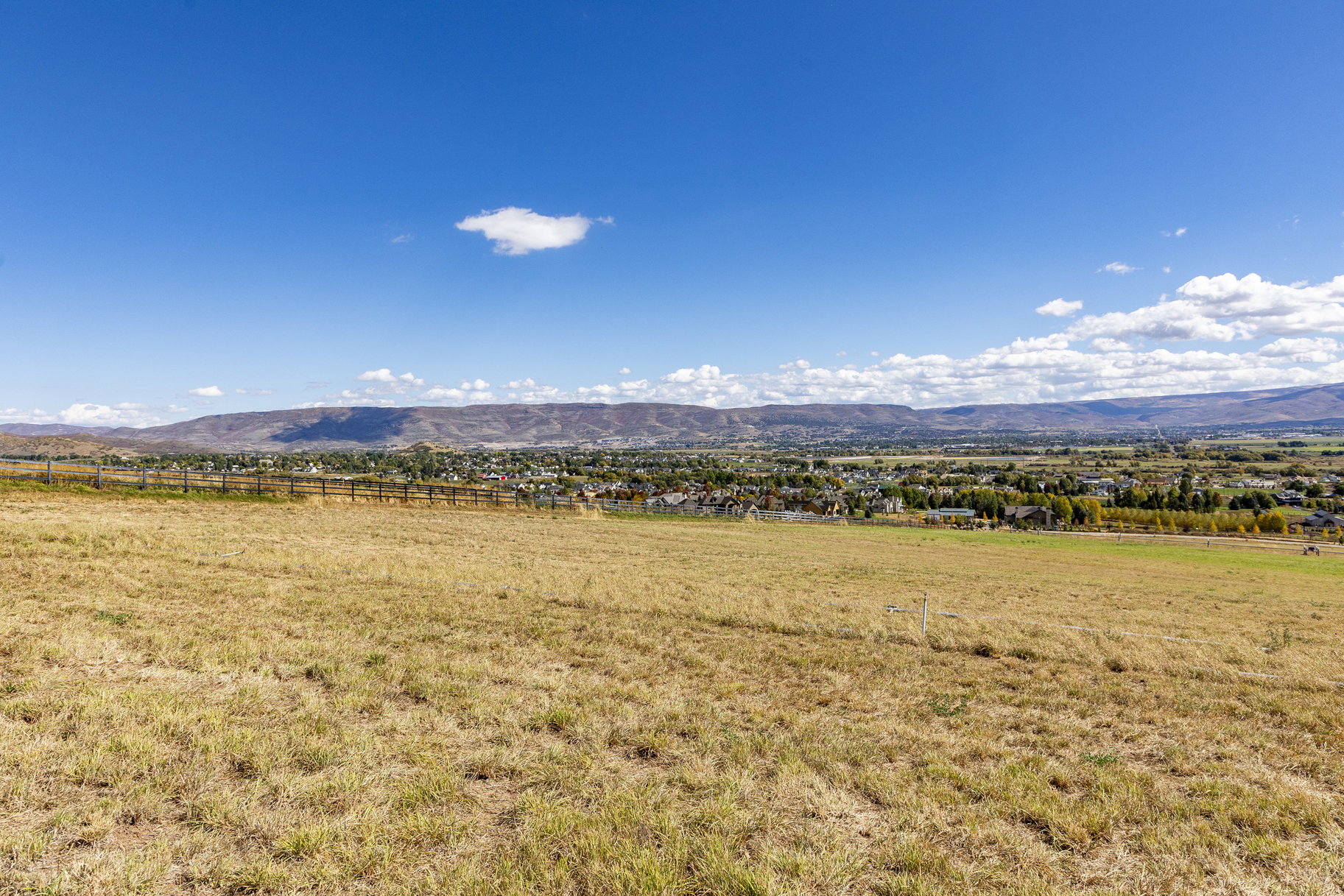 View of mountain background featuring rural landscape