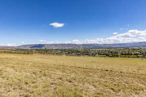 View of mountain background featuring rural landscape