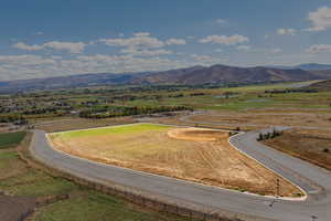 View of mountain background featuring rural landscape