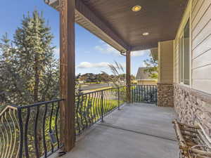 Covered porch with a residential view