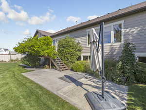 Back of property featuring stairway