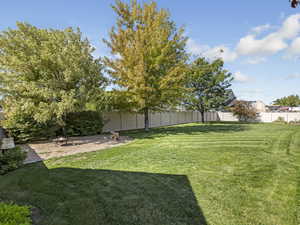 Fenced backyard featuring a patio area