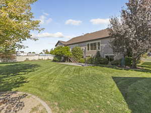 View of yard featuring a patio area and stairs