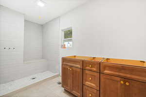 Master bathroom with a large walk in shower and double vanity