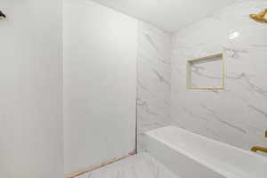 Second floor bathroom featuring a premium shower / bath combination