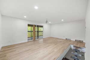 1st level living room featuring light wood-style floors and access to your deck.