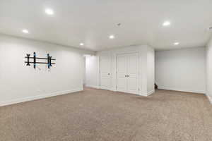 Basement featuring light colored carpet and recessed lighting
