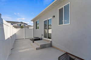 Fenced backyard featuring a patio