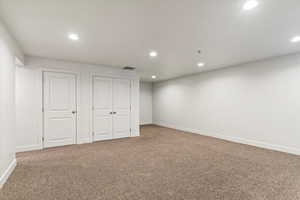 Below grade area featuring light carpet and recessed lighting