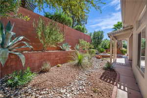 Fenced backyard with a patio area