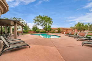 View of swimming pool featuring a patio and a fenced backyard