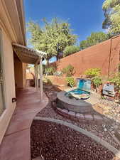 Fenced backyard featuring a patio area
