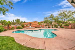 Community pool featuring a patio area and a community hot tub