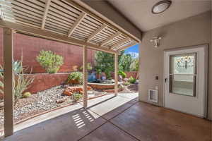 Fenced backyard with a patio