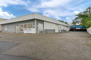 View of property with uncovered parking