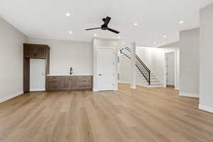 Unfurnished living room with ceiling fan, recessed lighting, and light wood-style floors