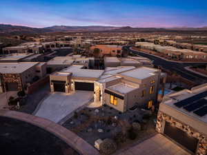 Aerial view at dusk of a residential view and a mountain view