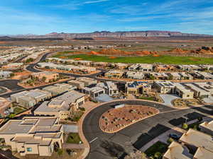 Aerial perspective of suburban area featuring a mountain backdrop