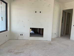 Unfurnished living room with plenty of natural light
