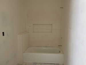 Bathroom featuring a garden tub