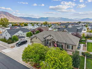 Aerial perspective of suburban area with a mountainous background